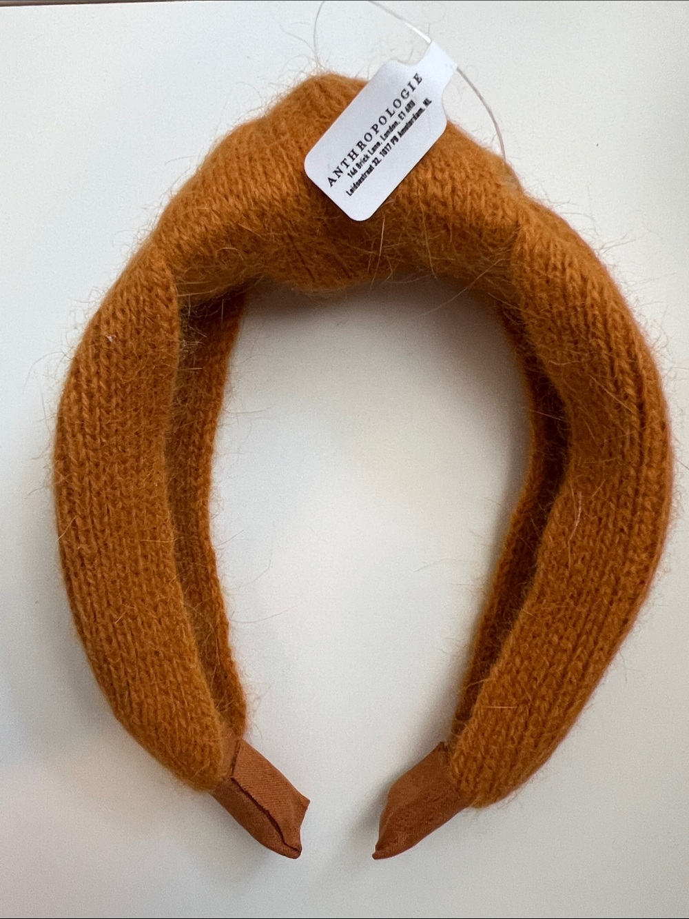 Anthropologie Cozy Fine Knit Knotted Headband in a rich mustard yellow (jaune)